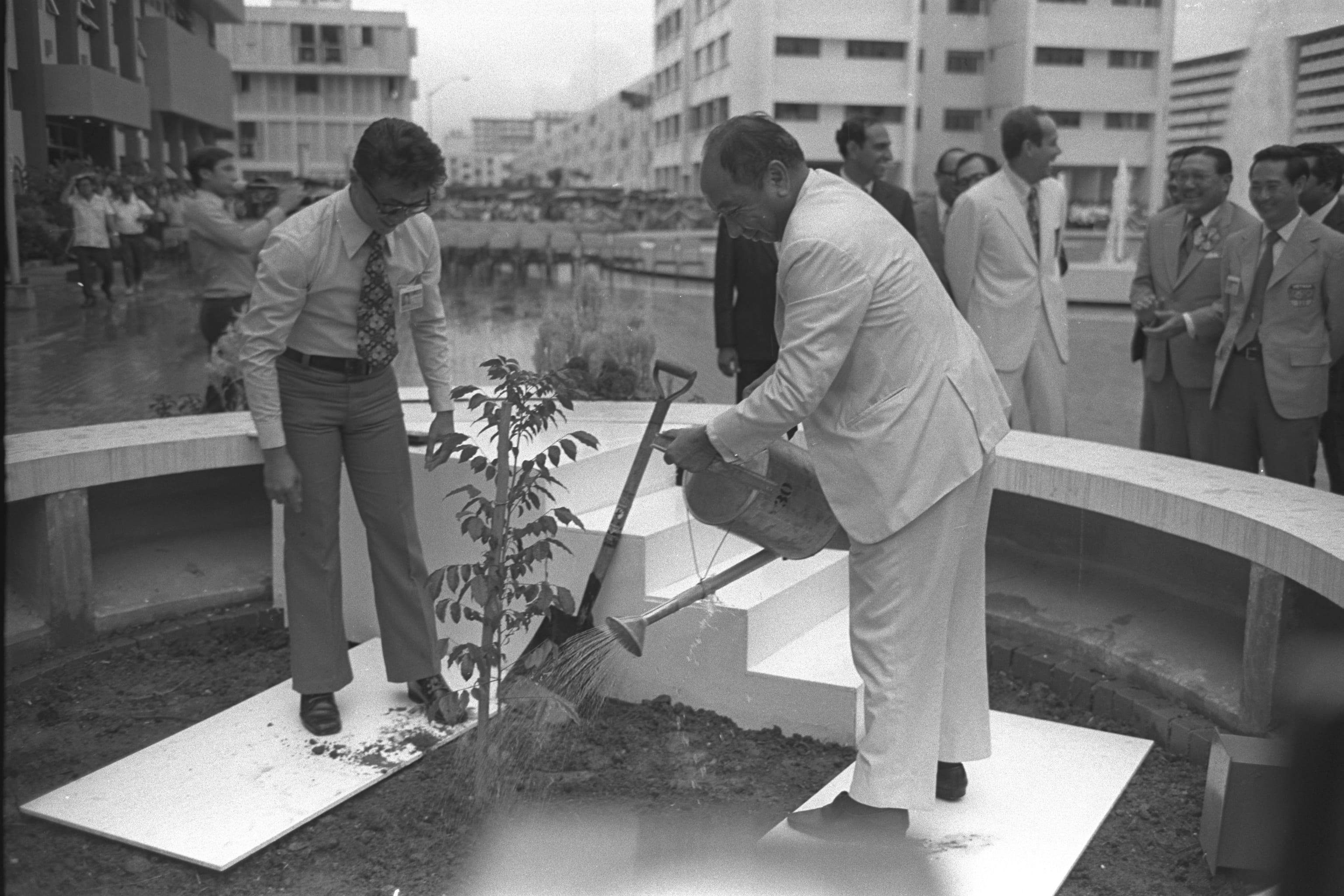 Deputy Prime Minister Goh Keng Swee planting a hop tree to mark the opening of the SEAP Games Village on 30 August 1973. Ministry of Information and the Arts Collection, courtesy of National Archives of Singapore.